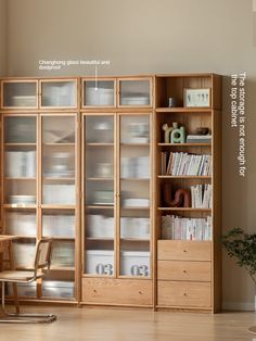 a bookcase with glass doors is shown in the living room