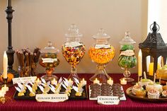 a table topped with lots of different types of candy and candies on top of it