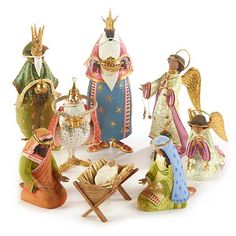 a group of christmas figurines sitting next to each other