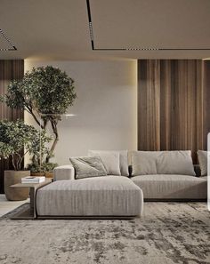 a living room filled with furniture and a tree in the corner on the wall behind it