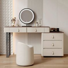 a dressing table with a mirror, stool and other items on it in front of a wall