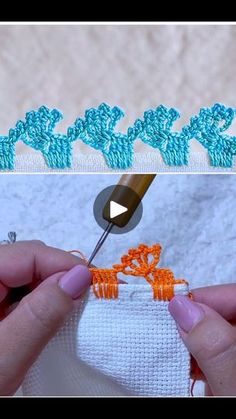 someone is crocheting an orange and blue piece of fabric with a sewing needle