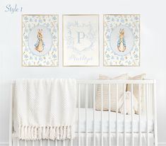 a white crib with two pictures hanging on the wall and a baby's bed