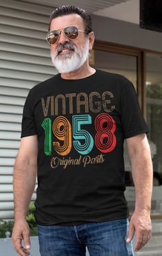 an older man wearing a vintage t - shirt with the year 1965 printed on it