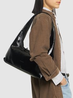 Find MARGE SHERWOOD Large Hobo Shoulder Bag on Editorialist. The MARGE SHERWOOD Large Hobo Shoulder Bag is crafted from leather. This hobo bag features a two-way zip closure, a fixed strap with a 15cm drop, and logo details. It measures 46cm in height, 48cm in width, and 10cm in depth. It can be worn on the shoulder. Online Sale, Online Sales, Vivienne Westwood, Manolo Blahnik, Hobo Bag, Jimmy Choo, Leather Shoulder Bag