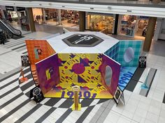 the interior of a shopping mall with an unusual display