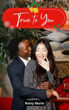 a man and woman hugging each other in front of a christmas card with the words true to you