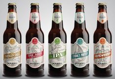 six beer bottles with different labels on them