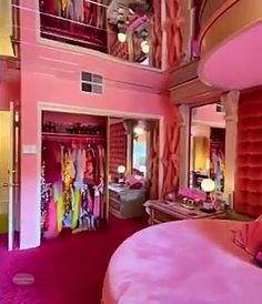 a bedroom decorated in pink and gold with lots of closet space