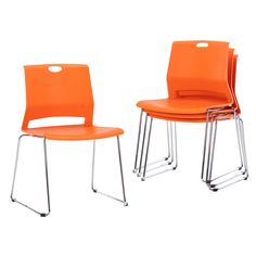 two orange chairs sitting next to each other