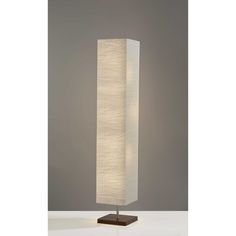 With this 57 inc two light column floor lamp with white rectangular shade you bring design along with some warm ambient lighting to your space. Unique and impactful, this column or tower shaped lamp is tall and rectangular emitting warm beautiful light. Use this lamp anywhere and elevate the look of the whole space. It is perfect for virtually any decor. 57.25 inc H x 10 inc W x 10 inc D. HomeRoots 57.25-in Walnut Floor Lamp | 4000372822 Column Floor Lamp, Walnut Floors, Crinkle Paper, Tower Design, White Floor Lamp, Cool Floor Lamps, Modern Pendant, Solid Metal, Floor Lamps