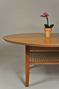 a wooden table with a potted plant on top