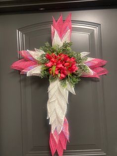 Beautiful Pink Easter Wreath. Handcrafted on a cross wire wreath frame with pink and white poly burlap mesh and finished with lovely pink tulips. Cross Wire Wreath, Auburn Wreath, Wreaths St Patricks, Cross Wreath, Wire Wreath Frame, Tulip Wreath, Yarn Wreath, Easter Cross, Pink Easter