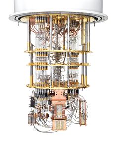 a person is working on a clock made out of metal parts and wires, which are connected to the back of an electrical device