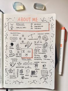 an open notebook with doodles and writing on it