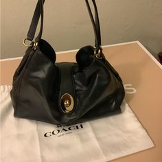 Coach Smooth Leather Carlyle Bag # F37637 Color Midnight Which Is Like A Dark Blue. Bag Is New And Comes With Dust Bag. Elegant Hobo Bag With Top Handle And Branded Hardware, Elegant Hobo Bag With Branded Hardware, Elegant Top Handle Hobo Bag With Branded Hardware, Coach Hobo Tote Bag With Branded Hardware, Designer Coach Hobo Tote Bag, Luxury Coach Hobo Bag With Branded Hardware, Coach Formal Bags With Branded Hardware, Elegant Hobo Bag With Branded Hardware In Satchel Shape, Chic Hobo Tote Bag With Branded Hardware