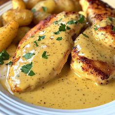 chicken with gravy and potatoes on a plate