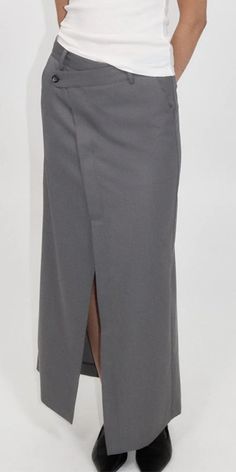 PLEASE NOTE THIS ITEM IS FINAL SALE The St. Agni Deconstructed Waist Maxi Skirt elevates timeless men's tailoring with a playful feminine twist. Made from responsibly sourced wool blend, this Pewter Grey skirt features an asymmetric waist, front and back split, and a tailored mid-rise fit. Stay refined yet casual with this versatile piece. Details: Color: Pewter Grey 50% RWS Wool / 50% Recycled Poly Lining: 100% lyocell Asymmetric waist detail Center front and back split at hem Vendor Code: W24- Grey Skirt, St Agni, Pewter Grey, Blue Flats, Gray Skirt, Skirts With Pockets, Long Skirt, Fashion Inspo Outfits, Wide Leg Pants