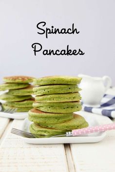 stack of spinach pancakes on a white plate