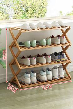 a wooden shoe rack with six pairs of shoes on it and measurements for each pair