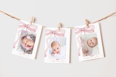 three baby photos hanging on clothes pins with pink bows and twine around the photo