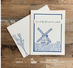 two cards with blue ink on them, one has a windmill and the other has flowers