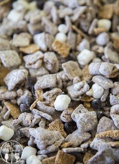 a close up view of dog food with white and brown puppy chow in the middle