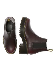 The Rometty is a women's Chelsea boot that strikes the perfect balance between femininity and the tough, rebellious Dr. Martens spirit. Packed with rugged features, the boot features a commando tread, a squared-off elastic gusset, an extra-empowering platform sole with a chunky heel, and a sleek silhouette. Pull-on Chelsea boot style Made with Burnished Wyoming, a leather with a subtle grain and oily surface - burnished to darken the toe and counter area Built on the iconic, comfortable Dr. Mart Chelsea Boots Style, Platform Chelsea Boots, Chelsea Boots Women, Boots Uk, Thick Socks, Clothes Horse, Chelsea Boot, Chunky Heel, Vintage Leather