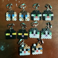 several pieces of lego style key chains on a table