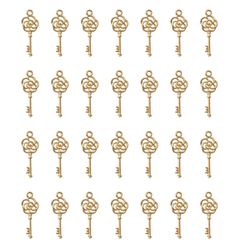 many gold keys are arranged in the shape of an ornate key on a white background