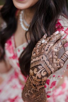 a woman with henna on her hands