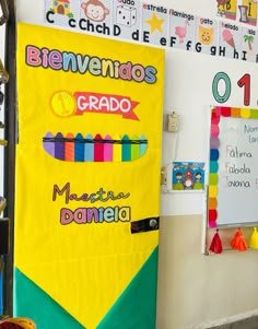 a bulletin board with crayons on it in front of a classroom wall filled with other school supplies