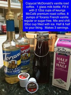 the ingredients to make an iced coffee drink are displayed on a counter top, including ice cream and syrup