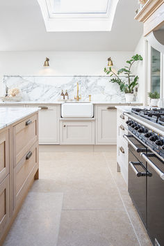 Beige natural stone tiles in a wood kitchen.