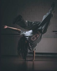 a person doing a handstand on the floor