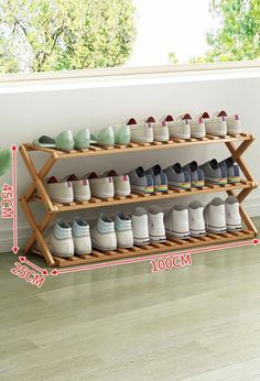 the shoe rack is holding many pairs of shoes and has two levels to hold them