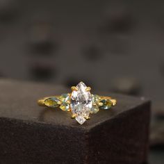 an engagement ring with three pear shaped diamonds