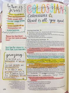 an open bible with colorful writing on the pages and other things in it that are handwritten