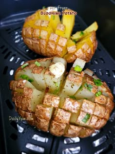 two pieces of food sitting on top of a black tray