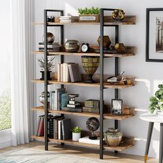 a bookshelf with several shelves and pictures on the wall in front of it