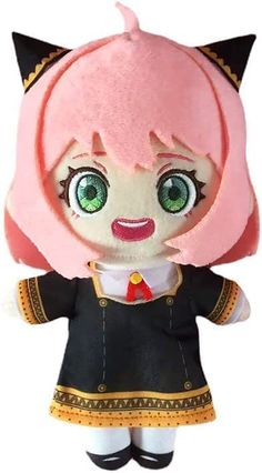 a stuffed animal doll with green eyes and pink hair