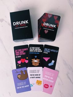 four cards with the words drunk on them sitting next to each other in front of a marble surface