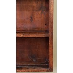 an old wooden bookcase with two shelves on the front and one shelf in the back