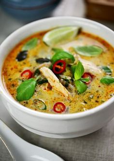 a close up of a bowl of soup on a table