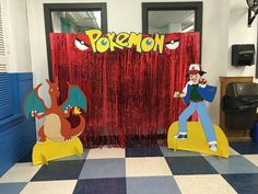 a room decorated with pokemon decorations and drapes for the door to an office building