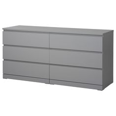 a large gray dresser sitting on top of a white floor