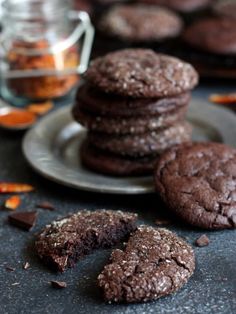 chocolate cookies on a plate with one broken in half