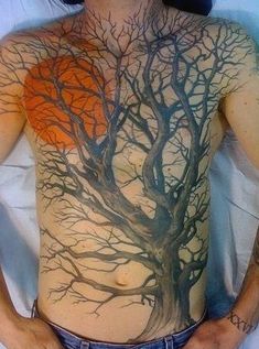 a man with a tree tattoo on his chest