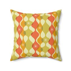 an orange and yellow pillow on a white background, with circles in the middle that are overlapping