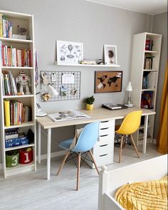 a bedroom with a bed, desk and bookshelf in the corner next to it